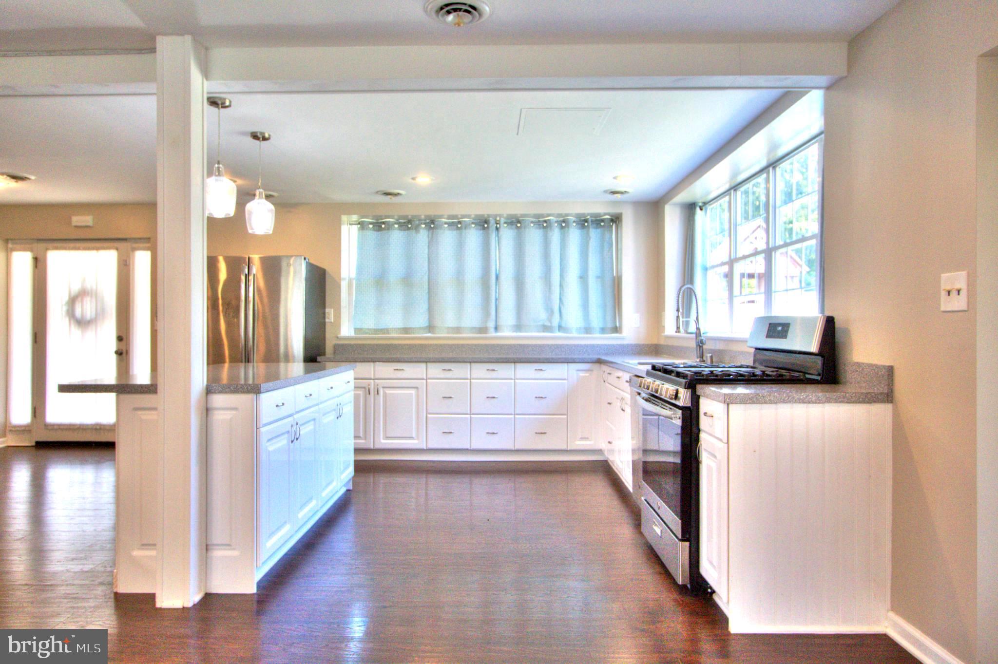 6200 Middleburg Road Keymar, MD 21757 - Photo 5 of 18 a kitchen with stainless steel appliances a stove top oven and a refrigerator