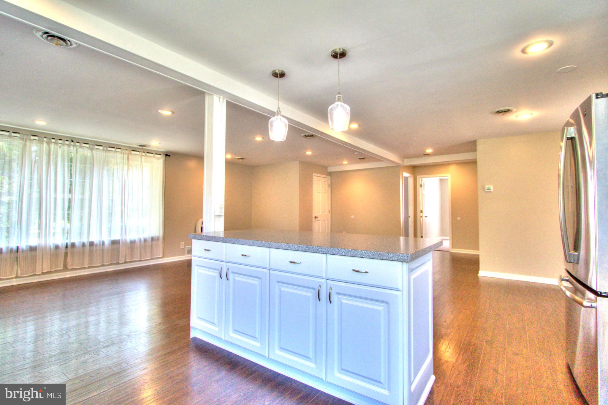 6200 Middleburg Road Keymar, MD 21757 - Photo 6 of 18 a bathroom with a large mirror vanity and shower