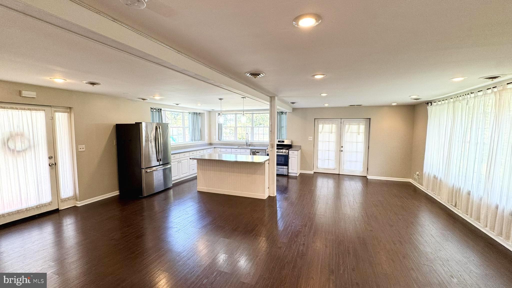 6200 Middleburg Road Keymar, MD 21757 - Photo 7 of 18 a view of a big room with wooden floor and windows