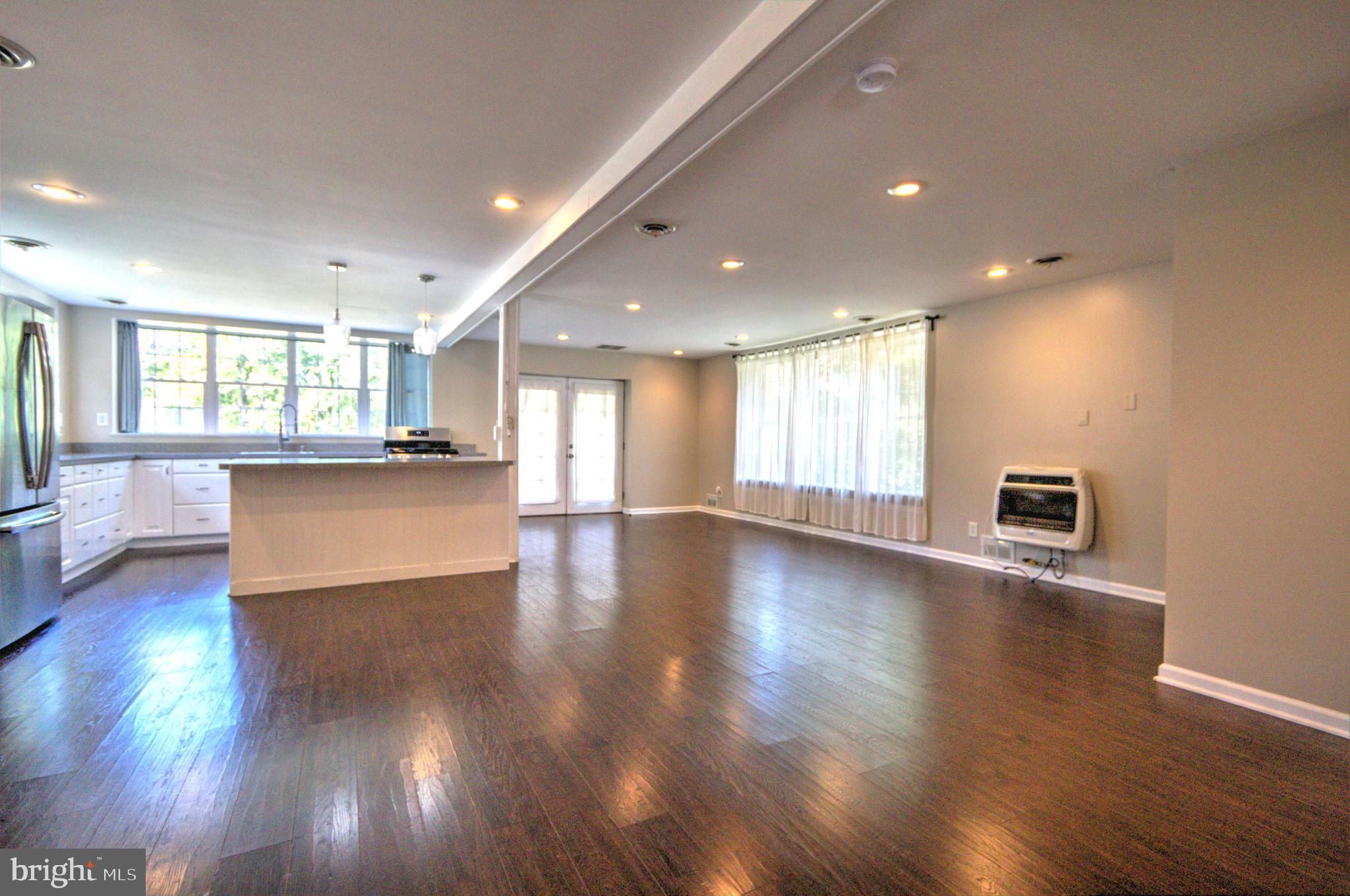 6200 Middleburg Road Keymar, MD 21757 - Photo 8 of 18 a view of a big room with wooden floors and windows