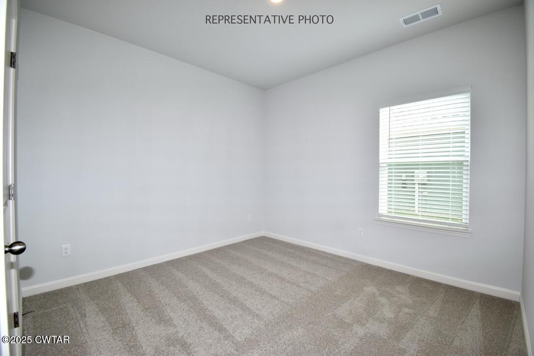 71 Clarendon Cove Jackson, TN 38305 - Photo 16 of 18 a view of an empty room with a window