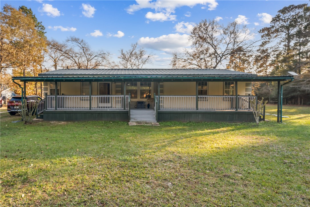 31351 Buckeye Road Waller, TX 77484 - Photo 1 of 1 a view of a house with a yard balcony and sitting area