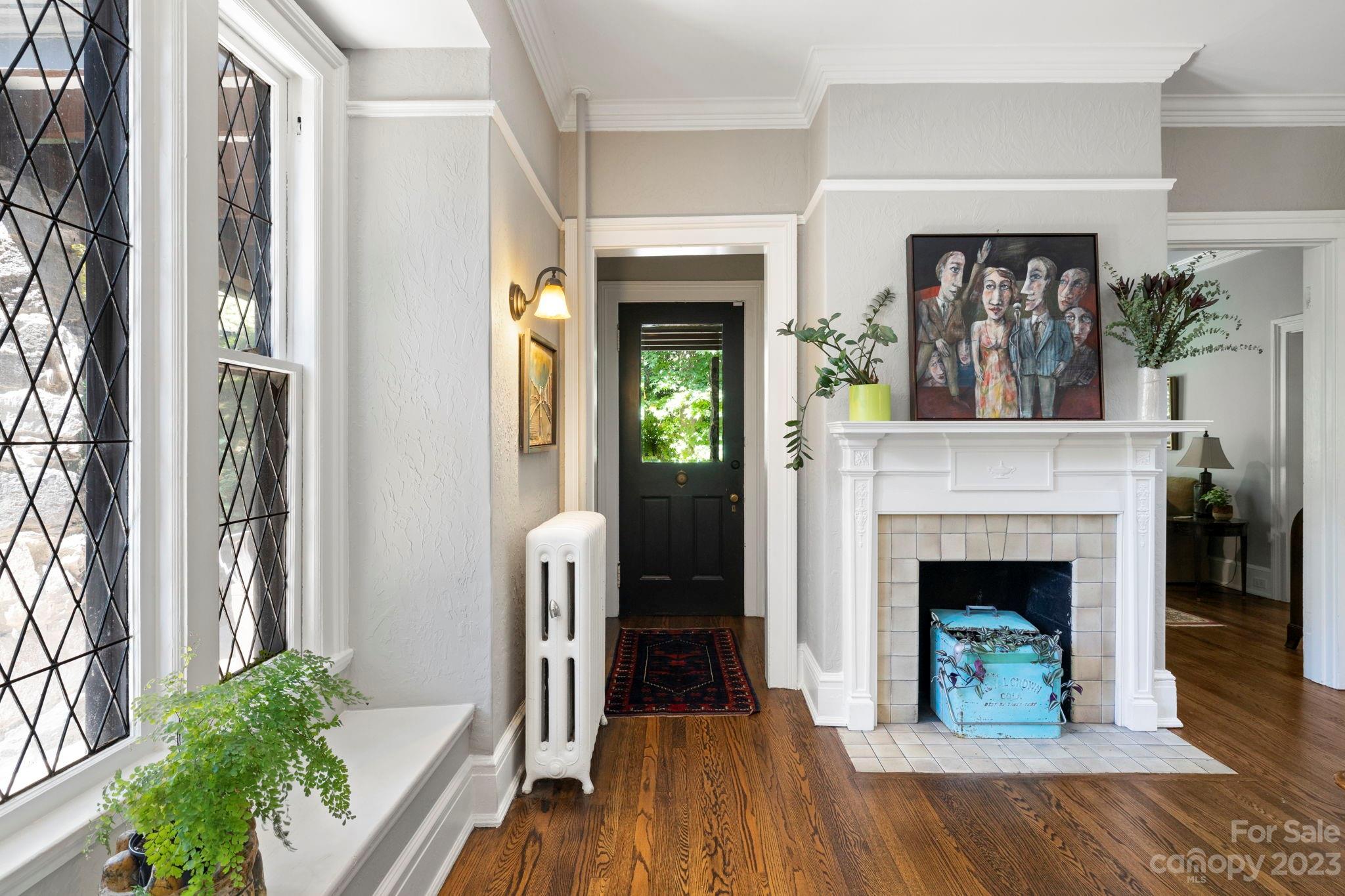 18 Cherokee Road Asheville, NC 28801 - Photo 12 of 45 a view of a livingroom with a fireplace and window