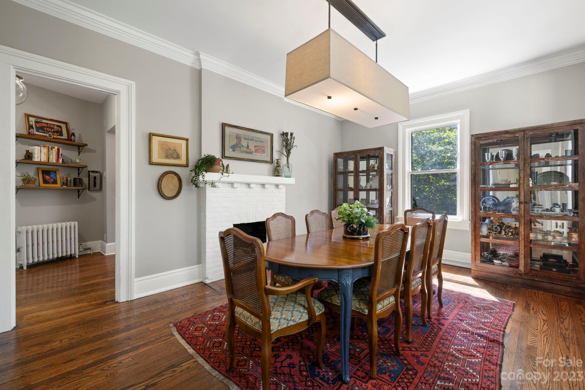 18 Cherokee Road Asheville, NC 28801 - Photo 15 of 45 a view of a dining room with furniture window and wooden floor