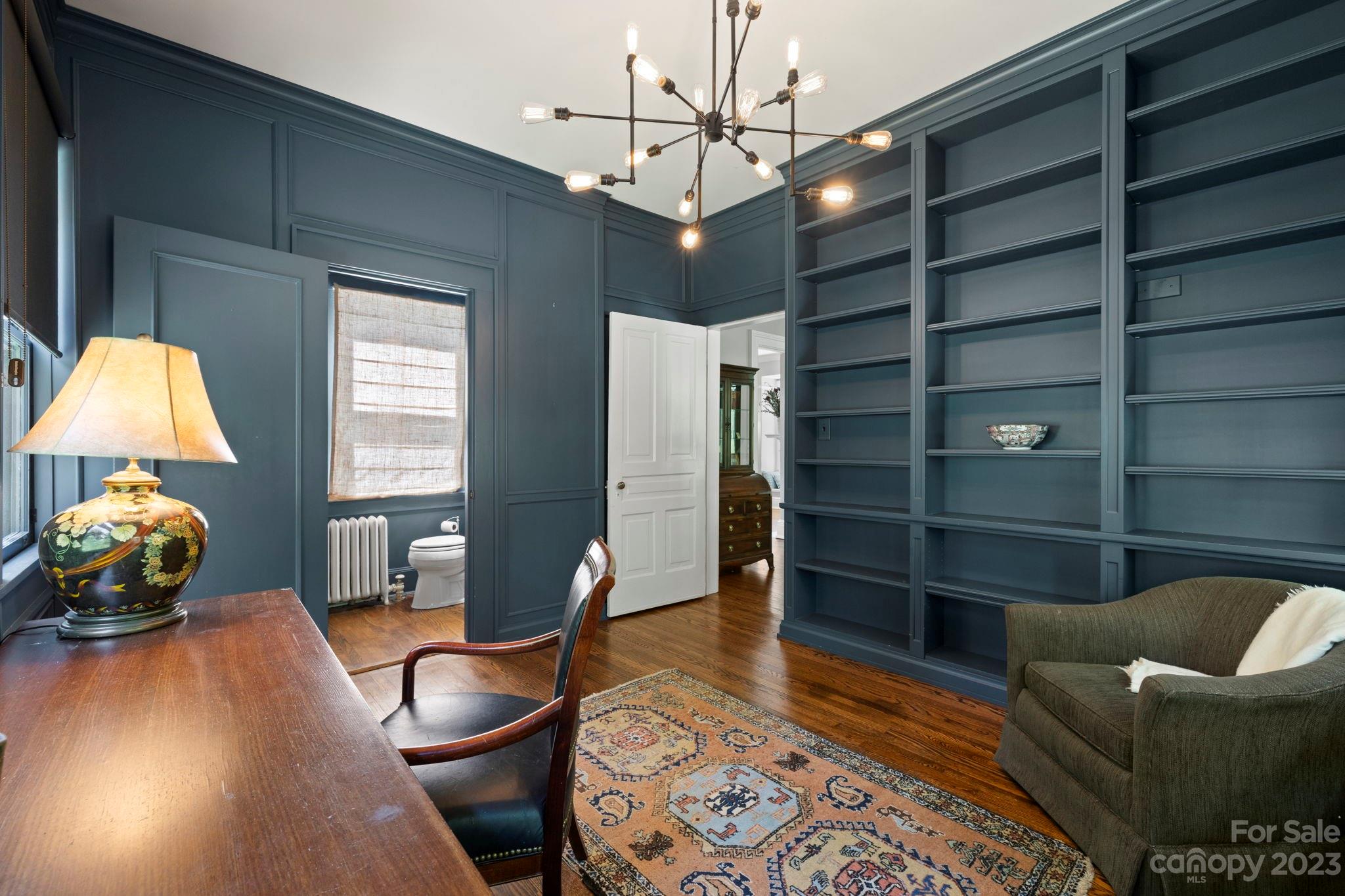 18 Cherokee Road Asheville, NC 28801 - Photo 21 of 45 a living room with furniture and a chandelier