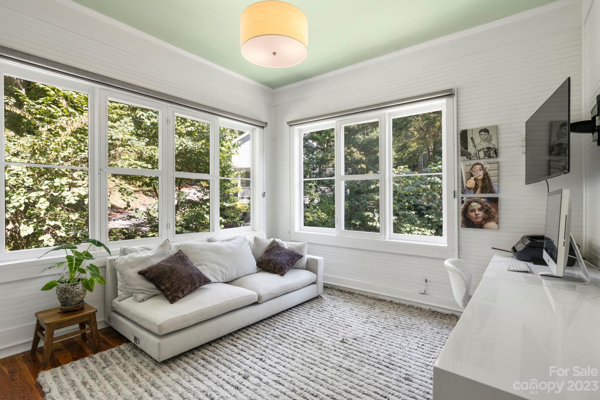 18 Cherokee Road Asheville, NC 28801 - Photo 25 of 45 a living room with furniture and a large window
