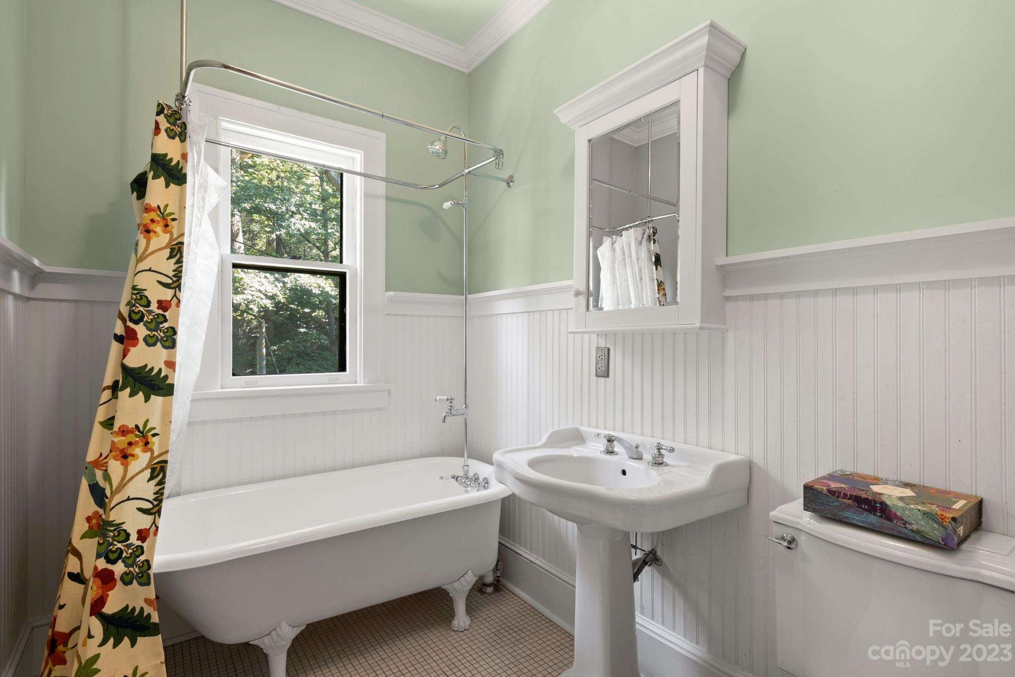 18 Cherokee Road Asheville, NC 28801 - Photo 27 of 45 a bathroom with a sink a toilet and a bathtub