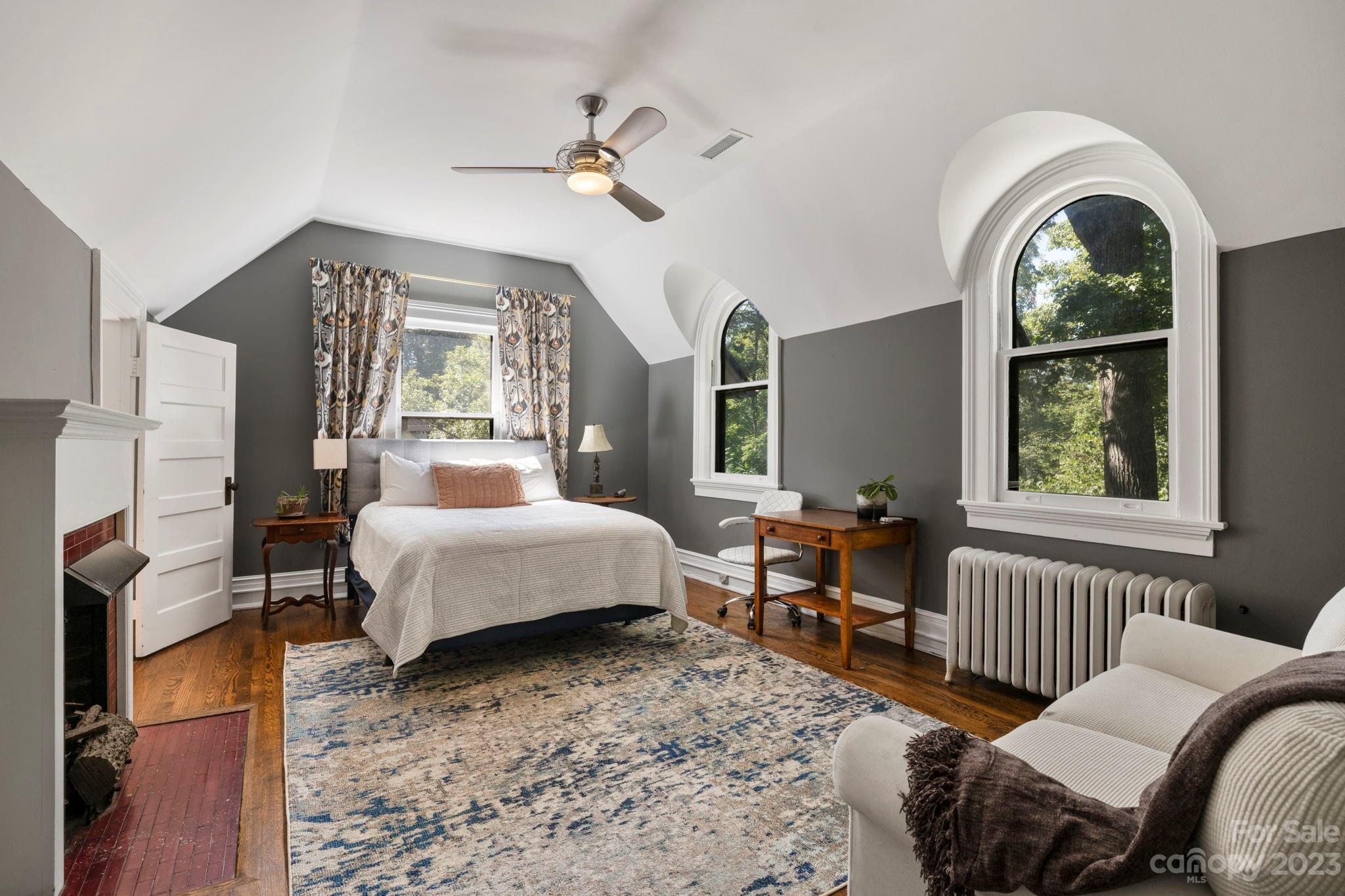 18 Cherokee Road Asheville, NC 28801 - Photo 28 of 45 a bedroom with furniture and a window