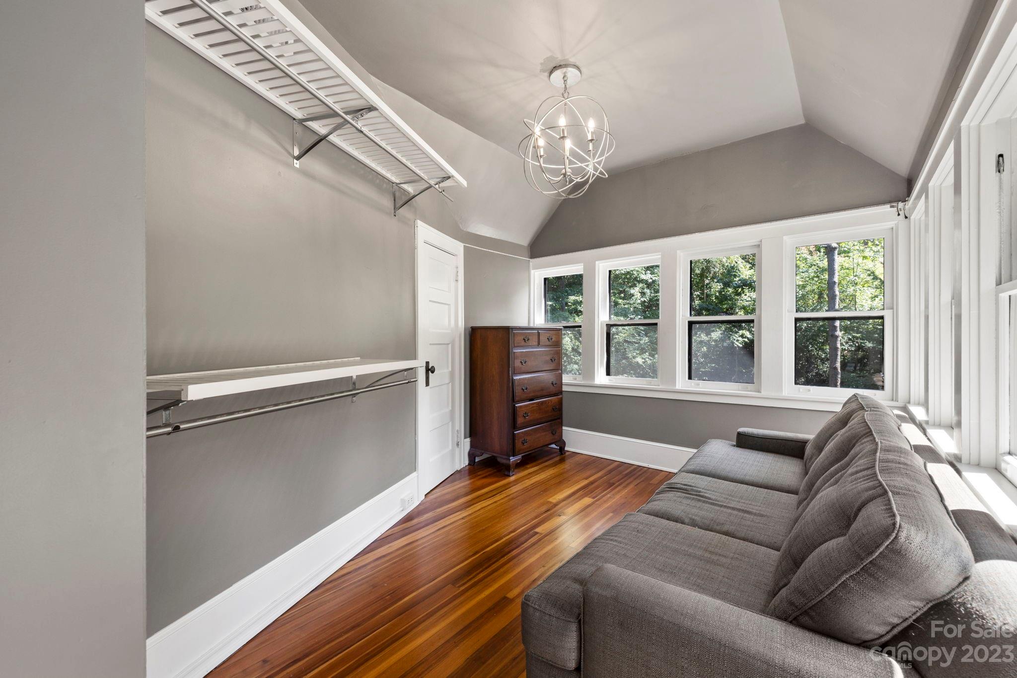 18 Cherokee Road Asheville, NC 28801 - Photo 29 of 45 a living room with furniture and a chandelier