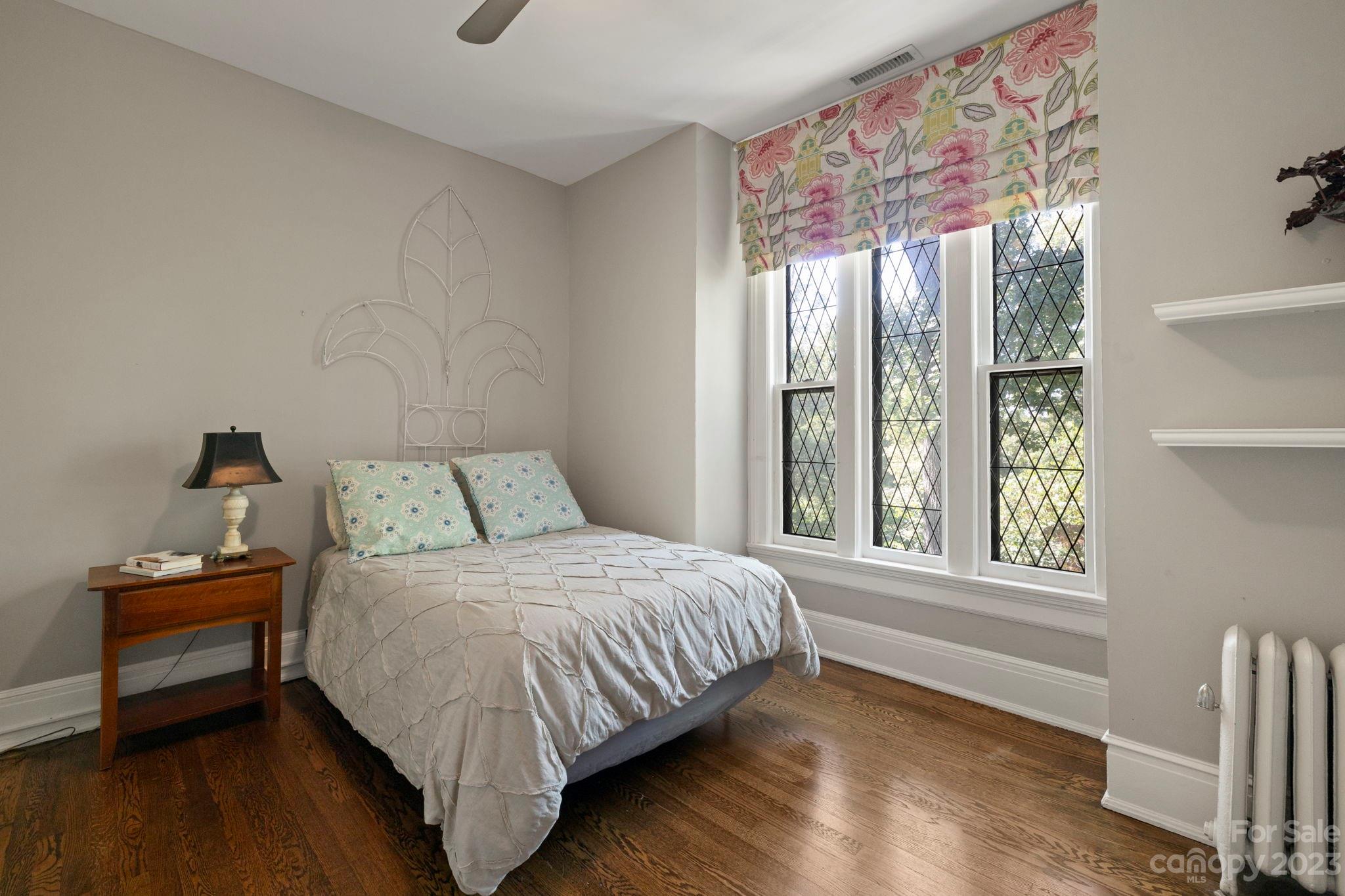 18 Cherokee Road Asheville, NC 28801 - Photo 31 of 45 a bedroom with a bed and a window