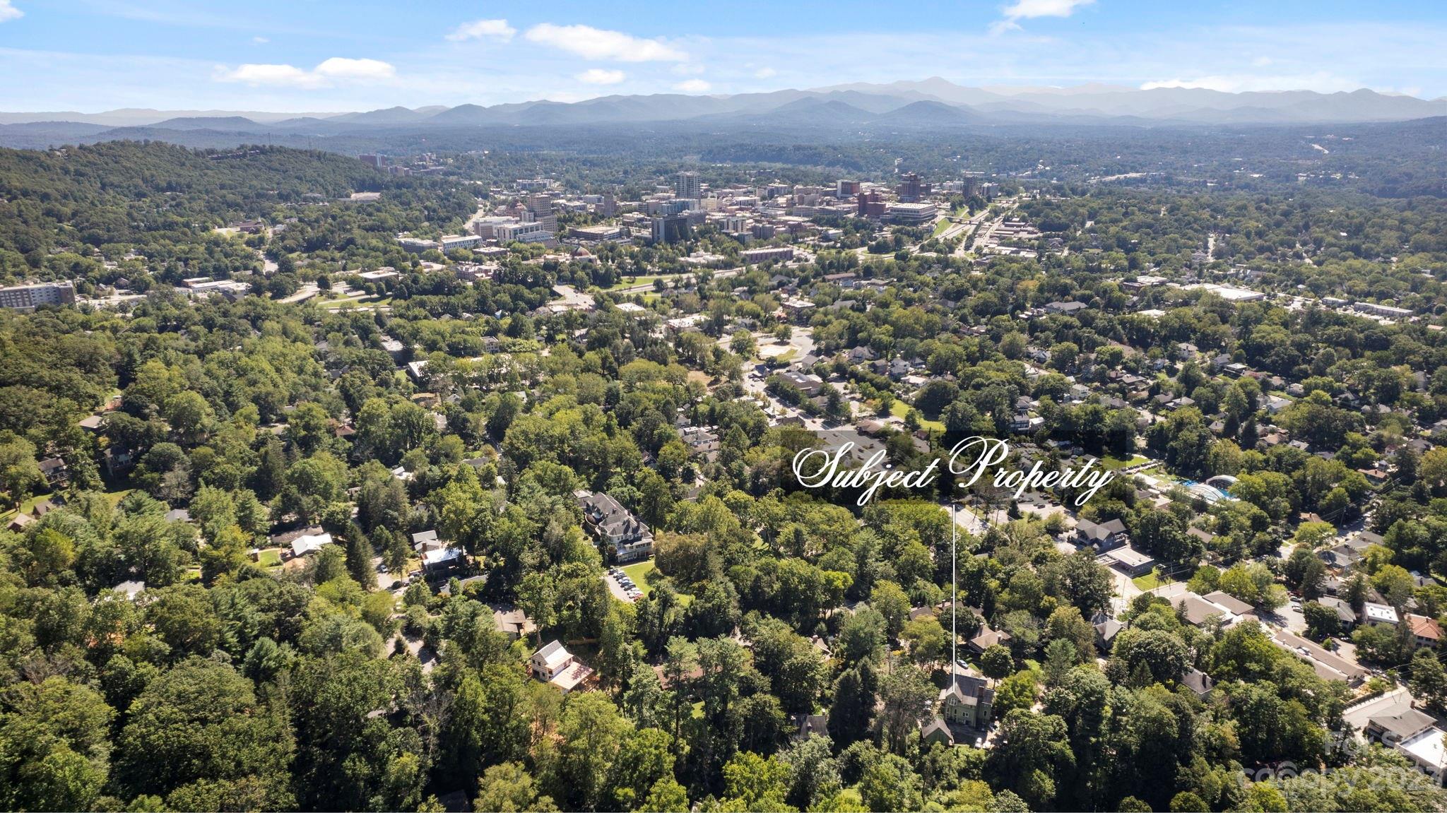 18 Cherokee Road Asheville, NC 28801 - Photo 39 of 45 an aerial view of house with yard and mountain view in back