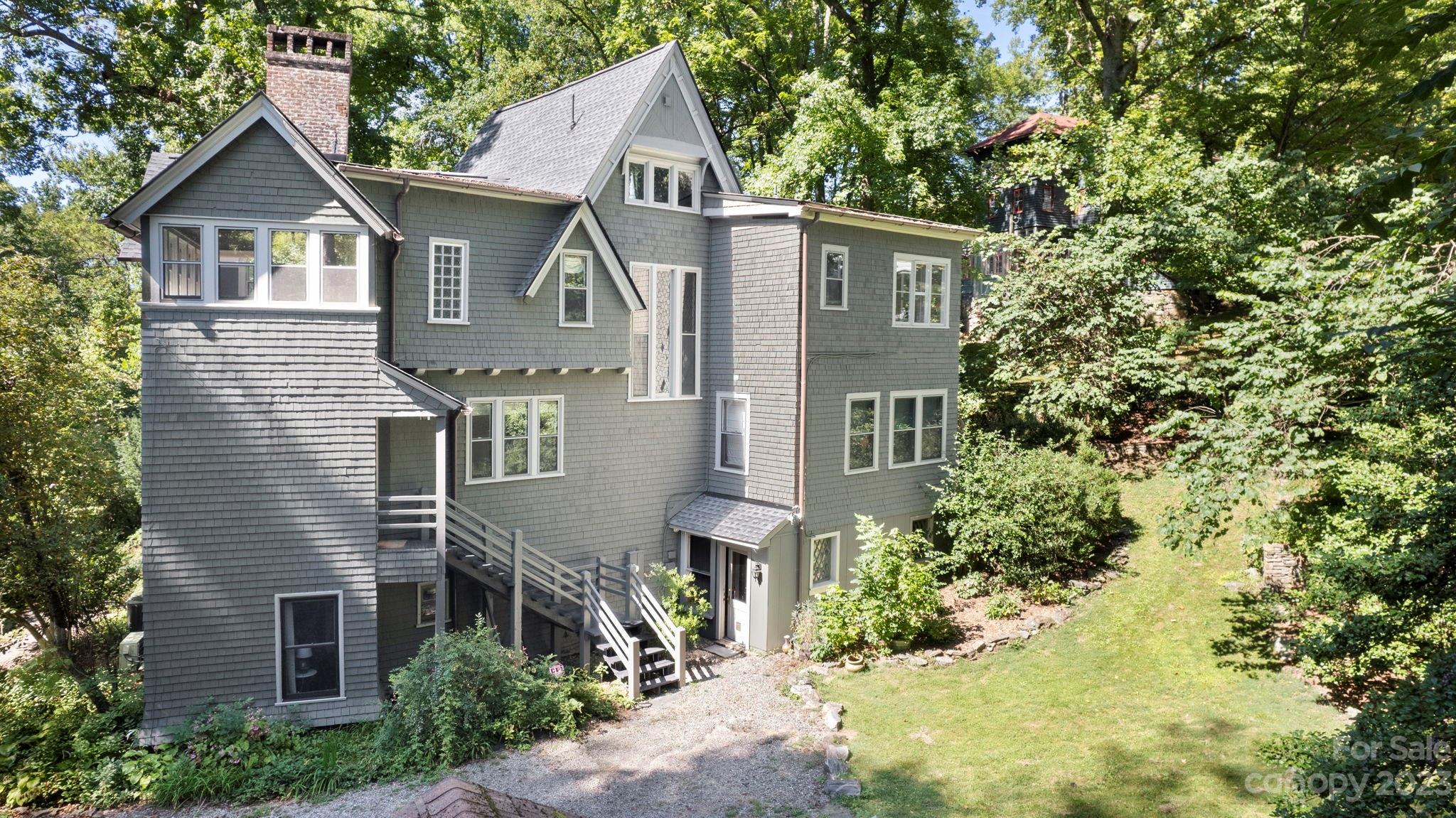 18 Cherokee Road Asheville, NC 28801 - Photo 4 of 45 a front view of a house with a yard and trees