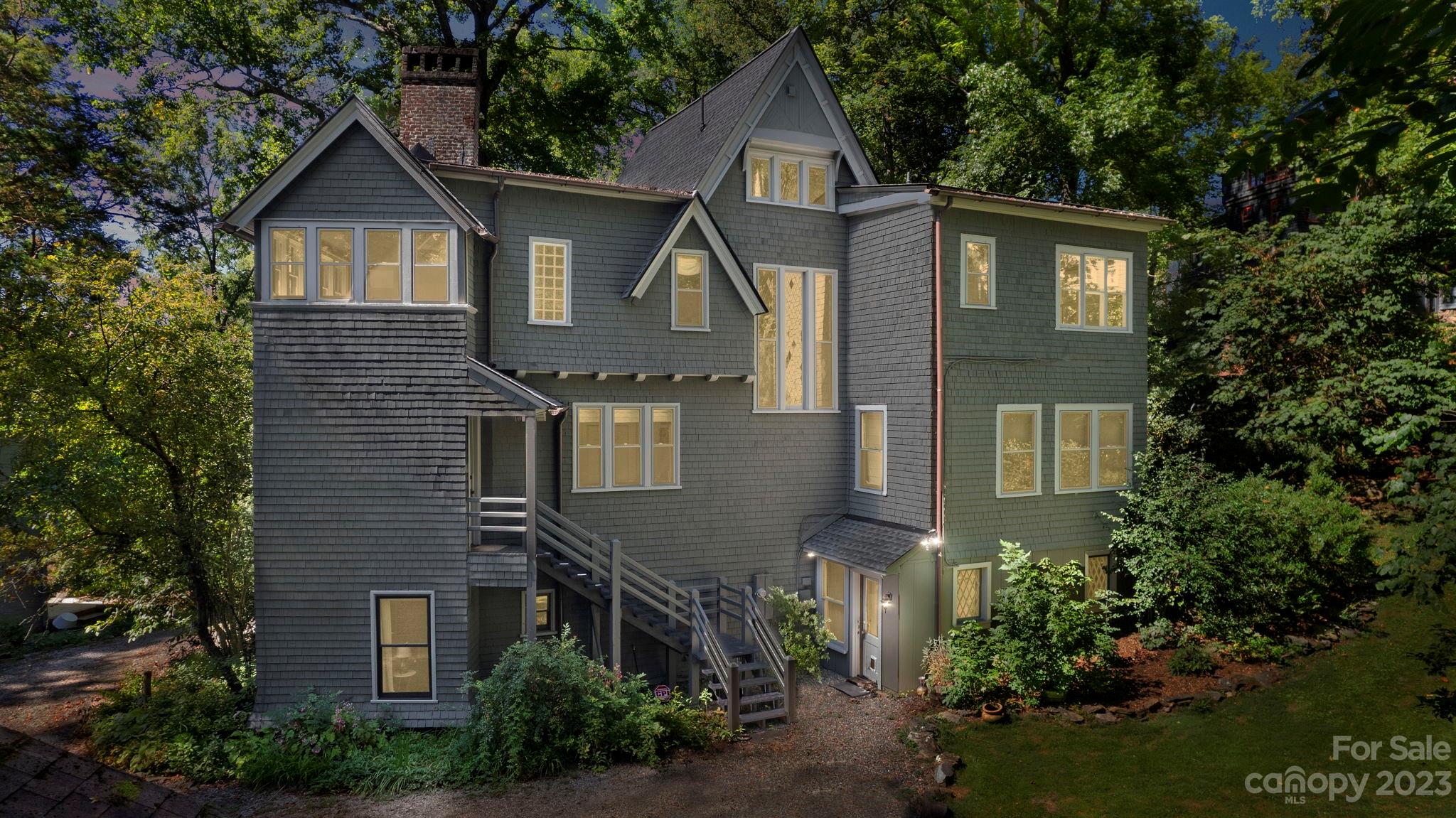 18 Cherokee Road Asheville, NC 28801 - Photo 5 of 45 a front view of a house with a yard and trees