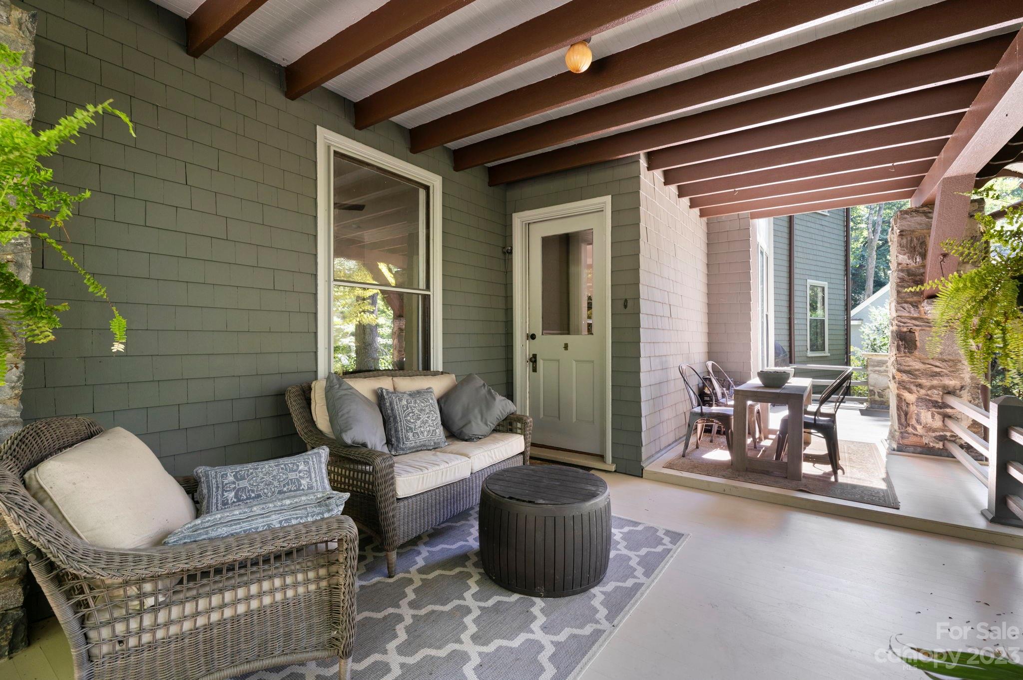 18 Cherokee Road Asheville, NC 28801 - Photo 8 of 45 a outdoor living space with furniture and a potted plant