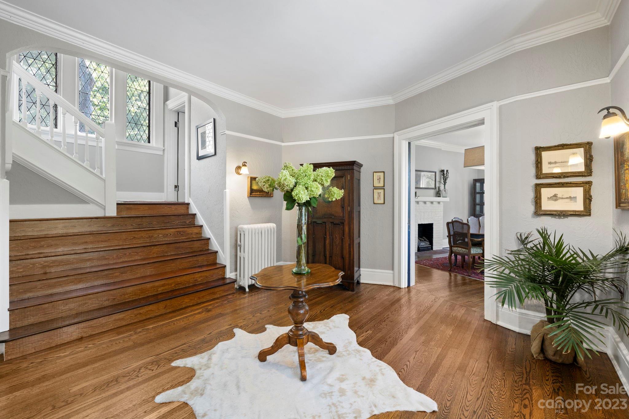 18 Cherokee Road Asheville, NC 28801 - Photo 9 of 45 a living room with furniture and a potted plant