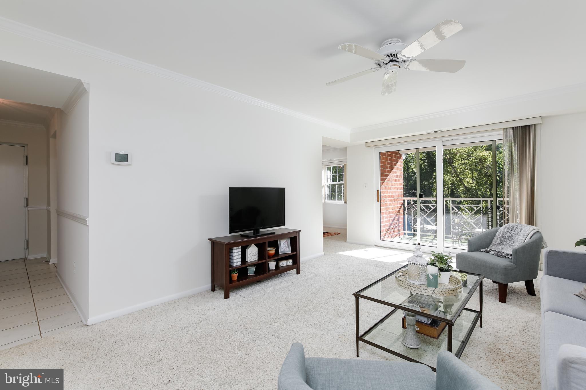 102 Castletown Road, Unit 302 Lutherville-Timonium, MD 21093 - Photo 3 of 16 Living room flows nicely to dining area & balcony