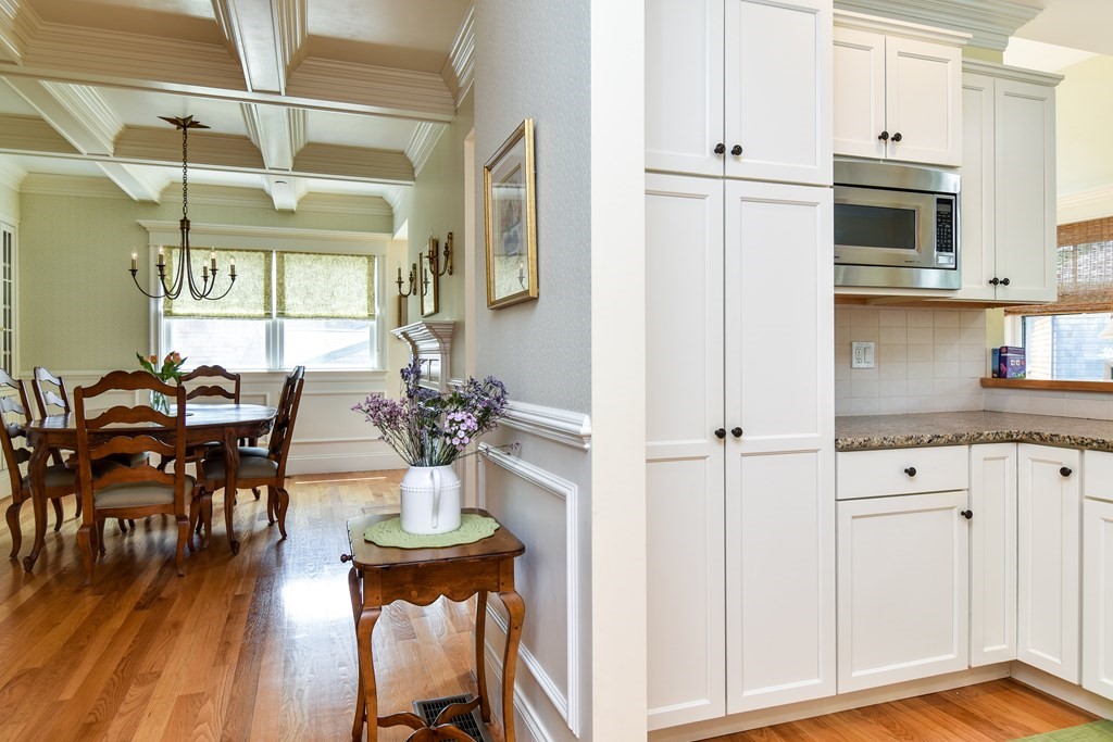 7 Hawthorne Lane, Unit 7 Dover, MA 02030 - Photo 12 of 30 a view of kitchen with cabinets and wooden floor