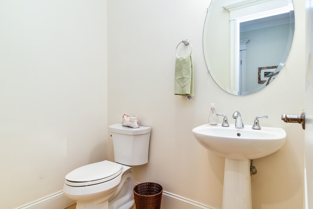 7 Hawthorne Lane, Unit 7 Dover, MA 02030 - Photo 14 of 30 a bathroom with a toilet sink and mirror