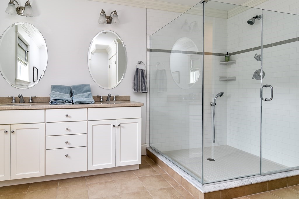 7 Hawthorne Lane, Unit 7 Dover, MA 02030 - Photo 18 of 30 a bathroom with a double vanity sink mirror and shower