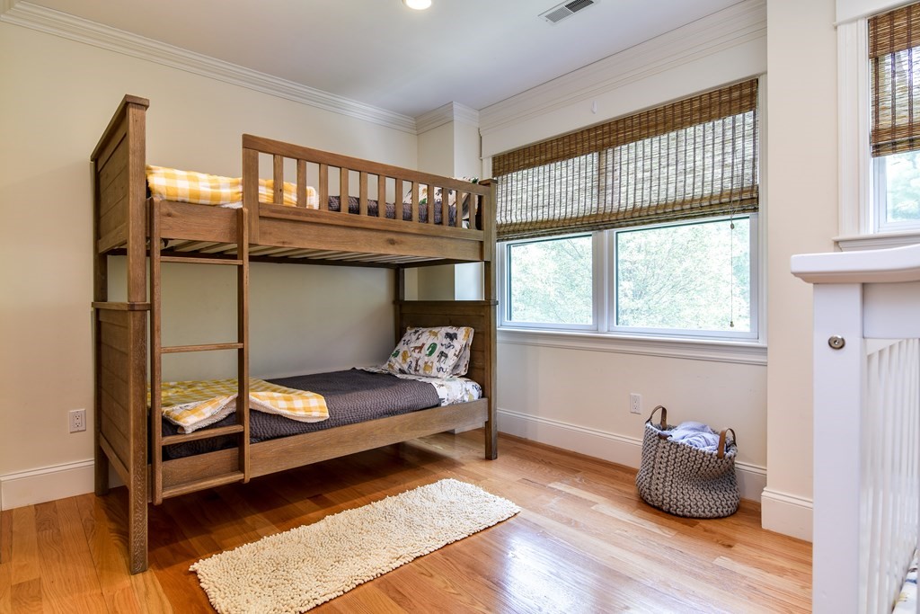 7 Hawthorne Lane, Unit 7 Dover, MA 02030 - Photo 19 of 30 a bedroom with furniture and a window