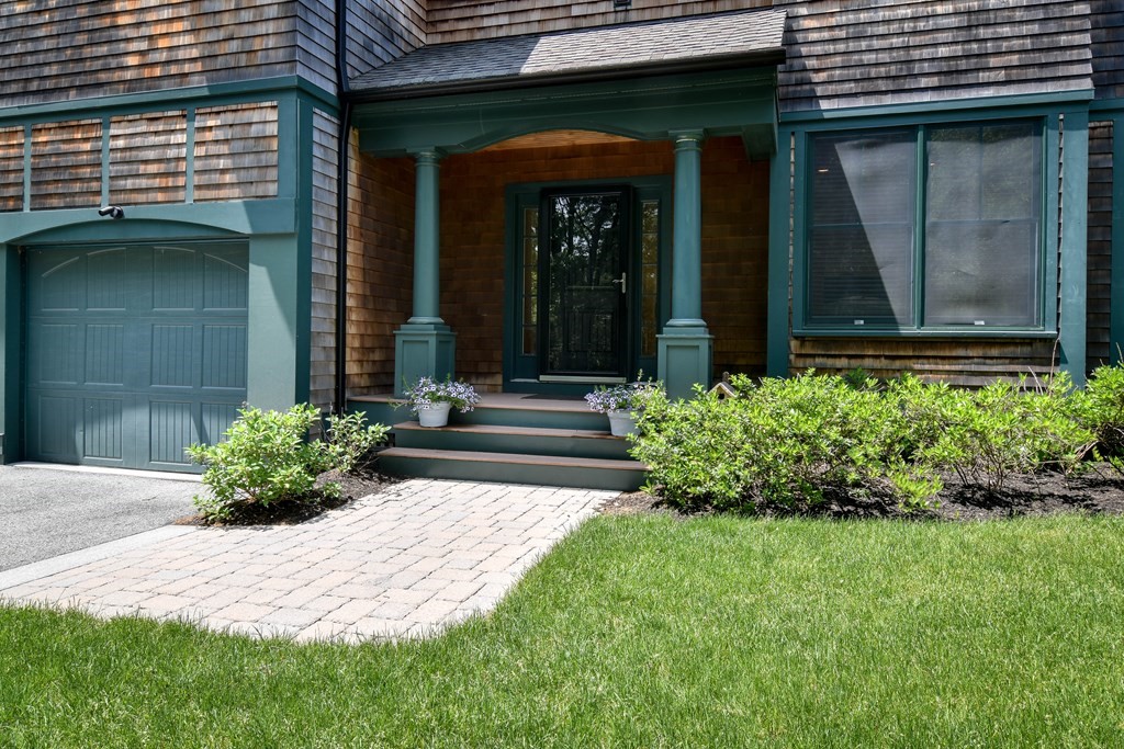 7 Hawthorne Lane, Unit 7 Dover, MA 02030 - Photo 2 of 30 a front view of a house with a yard