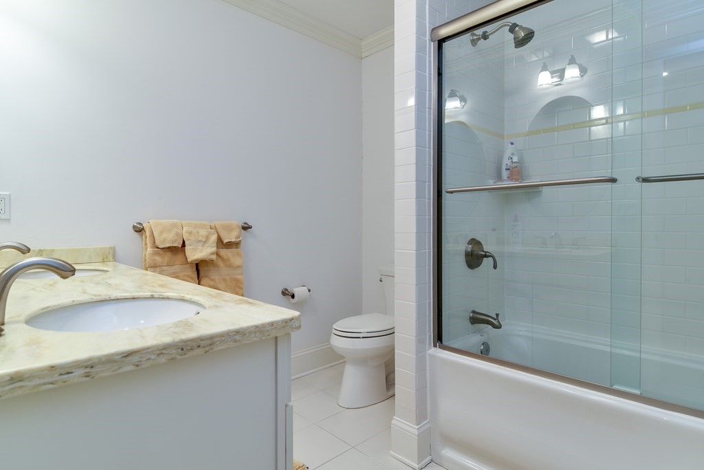 7 Hawthorne Lane, Unit 7 Dover, MA 02030 - Photo 22 of 30 a bathroom with a sink toilet and shower
