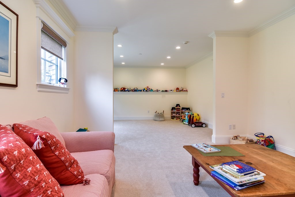 7 Hawthorne Lane, Unit 7 Dover, MA 02030 - Photo 25 of 30 a living room with furniture and a couch