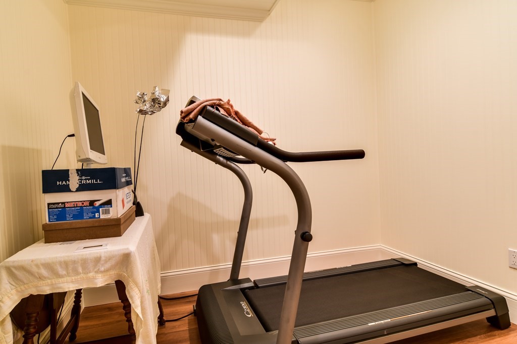 7 Hawthorne Lane, Unit 7 Dover, MA 02030 - Photo 27 of 30 a view of a room with gym equipment