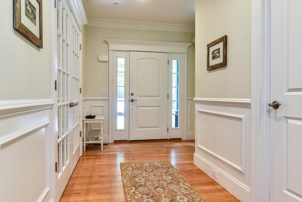 7 Hawthorne Lane, Unit 7 Dover, MA 02030 - Photo 3 of 30 a view of a hallway with white walls and stairs