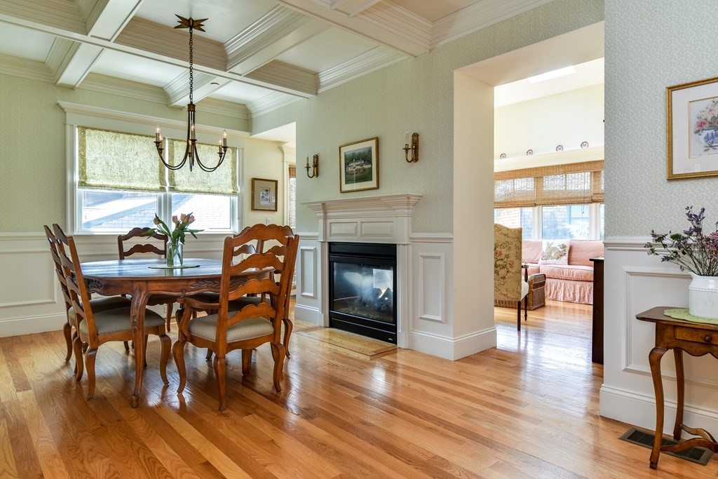 7 Hawthorne Lane, Unit 7 Dover, MA 02030 - Photo 5 of 30 a dining room with furniture a floor to ceiling window and wooden floor
