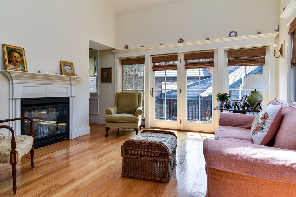 7 Hawthorne Lane, Unit 7 Dover, MA 02030 - Photo 6 of 30 a living room with furniture and a fireplace