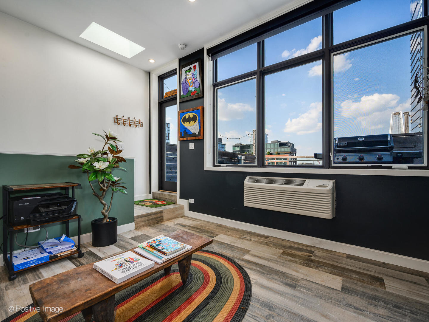 1000 West Washington Boulevard, Unit 542 Chicago, IL 60607 - Photo 24 of 29 a bedroom with a bed table and a flat screen tv
