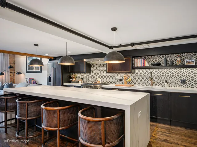 a kitchen with a sink and wooden cabinets