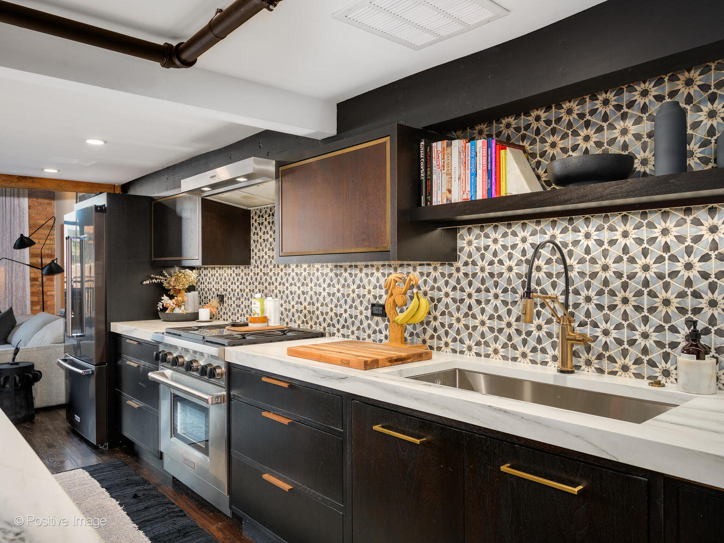 1000 West Washington Boulevard, Unit 542 Chicago, IL 60607 - Photo 9 of 29 a kitchen with stainless steel appliances a sink dishwasher a stove and a microwave oven