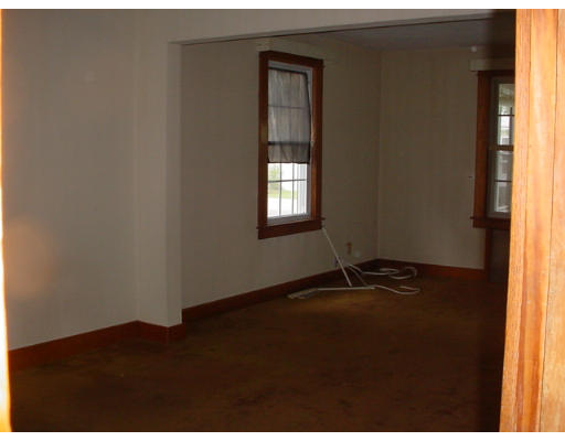 100 Wilber Street Springfield, MA 01104 - Photo 5 of 9 a view of an empty room with wooden floor and windows