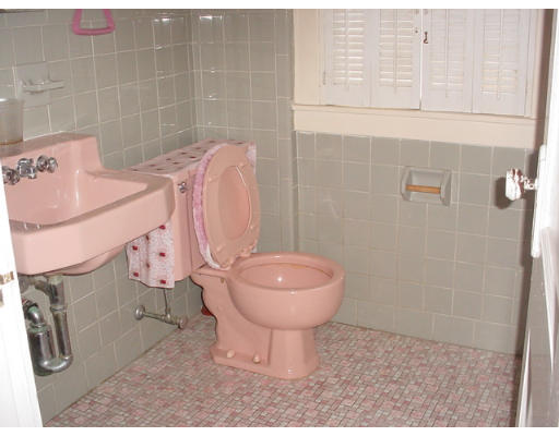 100 Wilber Street Springfield, MA 01104 - Photo 8 of 9 a bathroom with a sink a toilet and a mirror