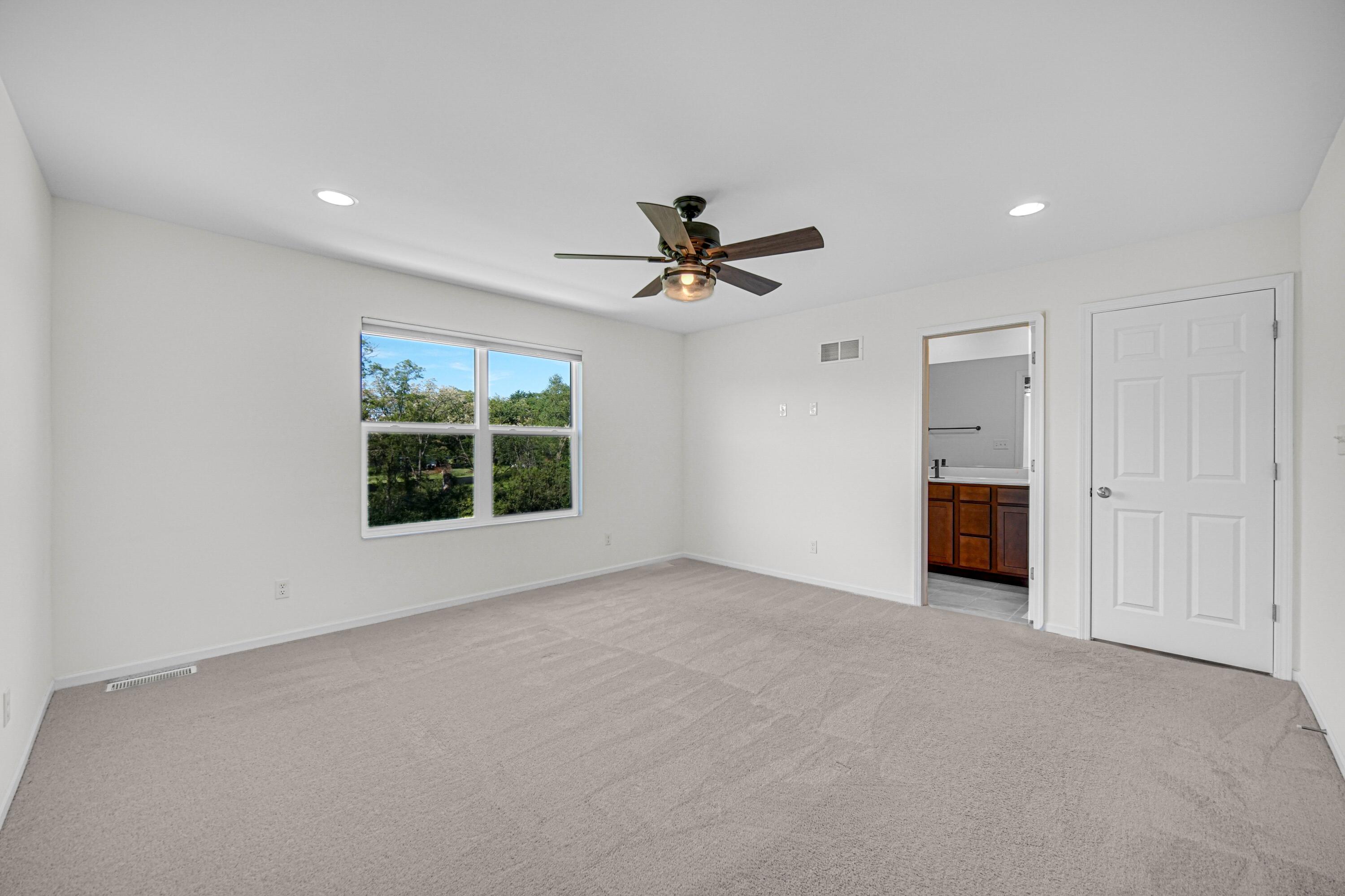 5710 Burr Rdg Circle Crown Point, IN 46307 - Photo 20 of 35 a view of a livingroom with a ceiling fan and window