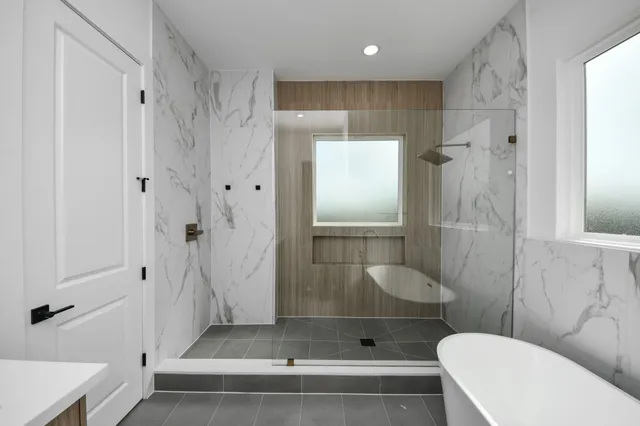 a bathroom with a shower and a toilet