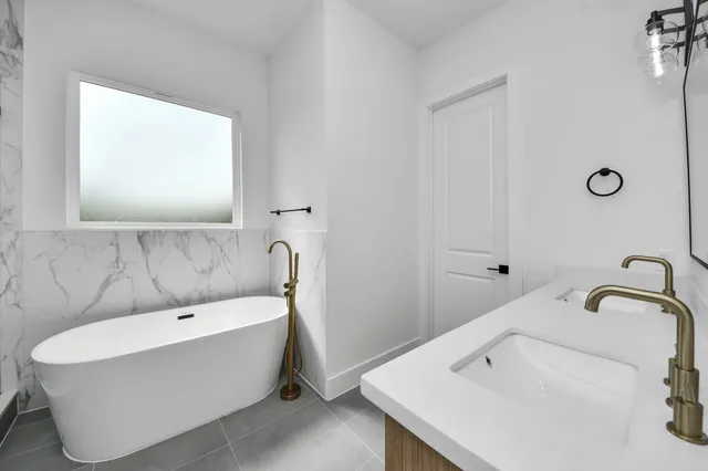 a bathroom with a sink and a bathtub