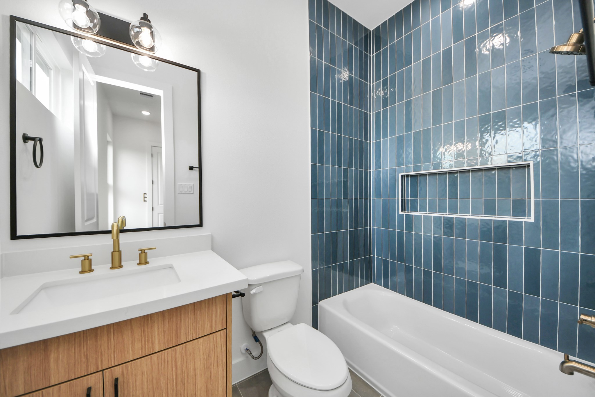6949 Foster Street Houston, TX 77021 - Photo 32 of 40 a bathroom with a sink toilet vanity and shower