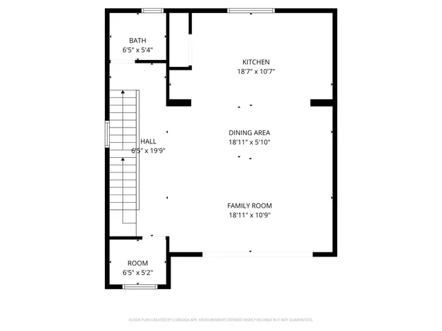 a picture of a bench in front of a wall