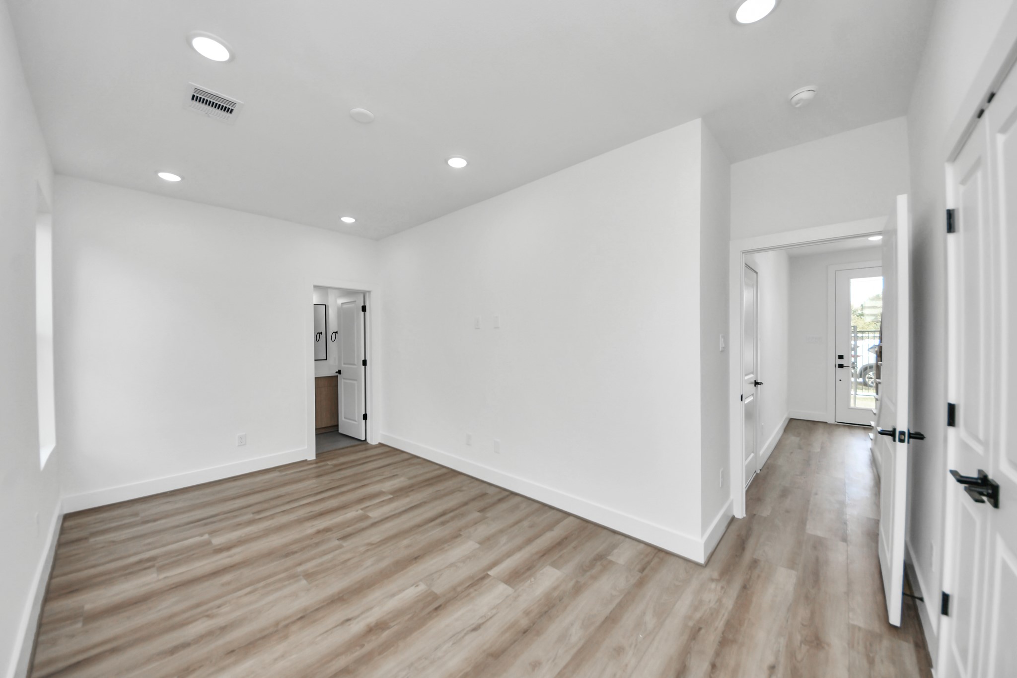 6949 Foster Street Houston, TX 77021 - Photo 5 of 40 wooden floor in an empty room with a window