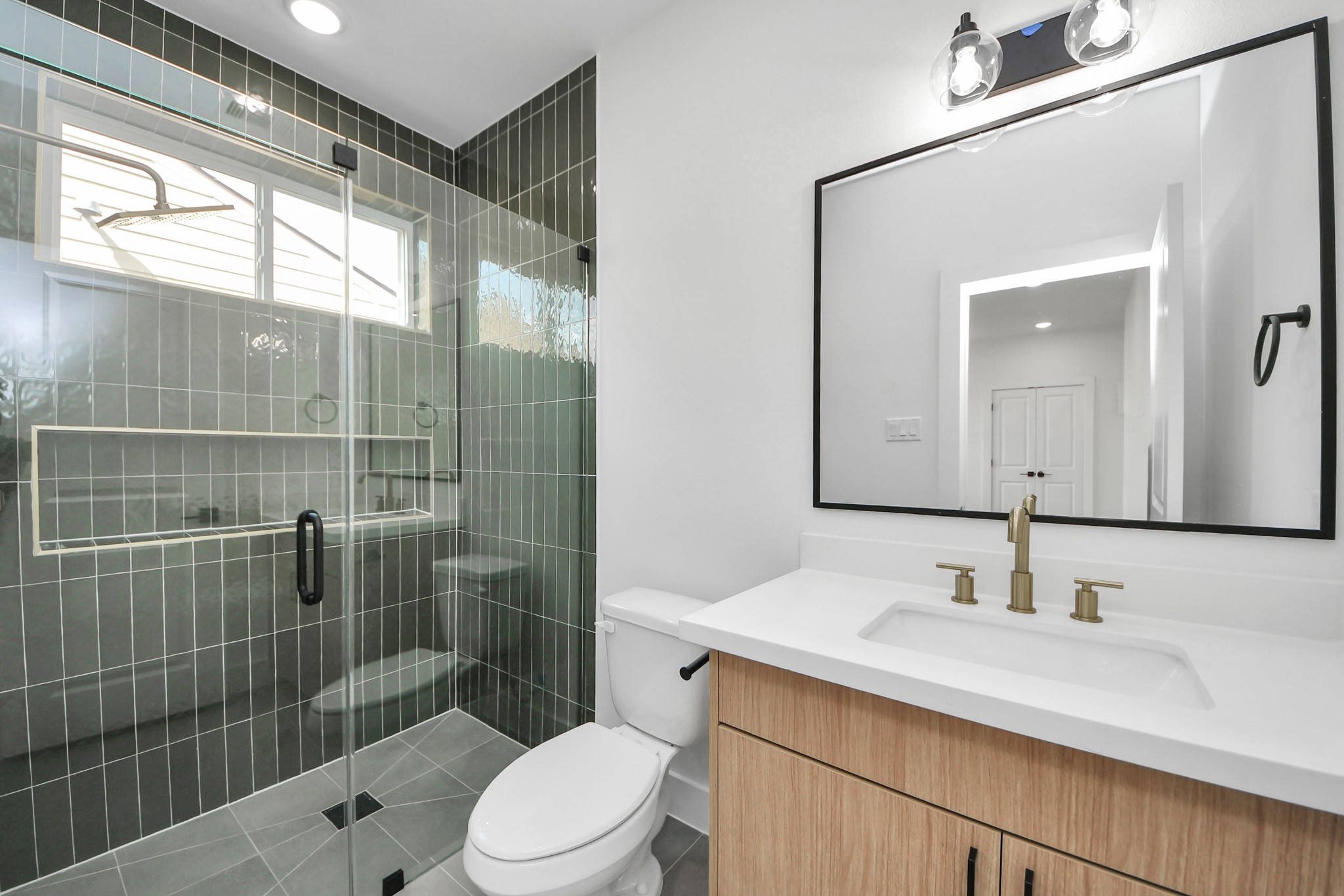 6949 Foster Street Houston, TX 77021 - Photo 7 of 40 a bathroom with a sink a toilet and shower