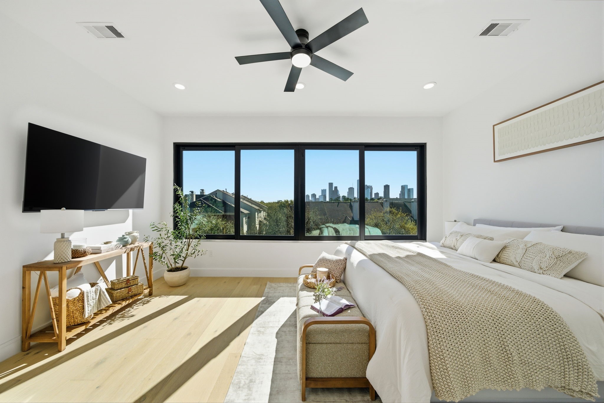 809 Memorial Heights Drive Houston, TX 77007 - Photo 21 of 40 a bed room with a flat screen tv and a large window