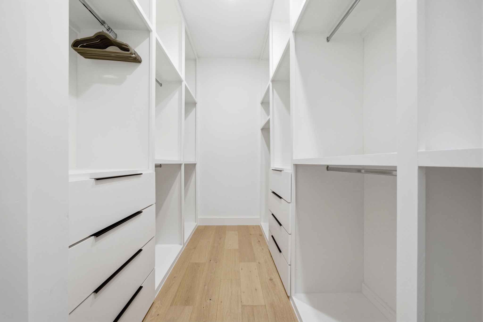 809 Memorial Heights Drive Houston, TX 77007 - Photo 23 of 40 a view of walk in closet with empty racks