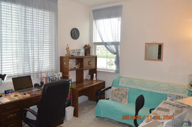 a work room with furniture and a window