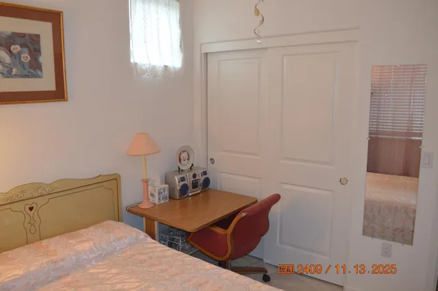 a room with table chairs and window