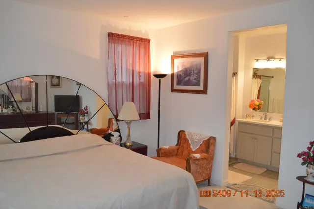 a bedroom with a bed and a table in it