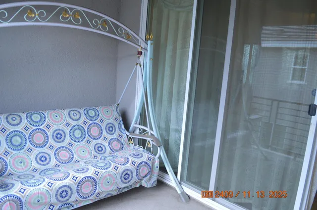 a view of a bedroom with a small window