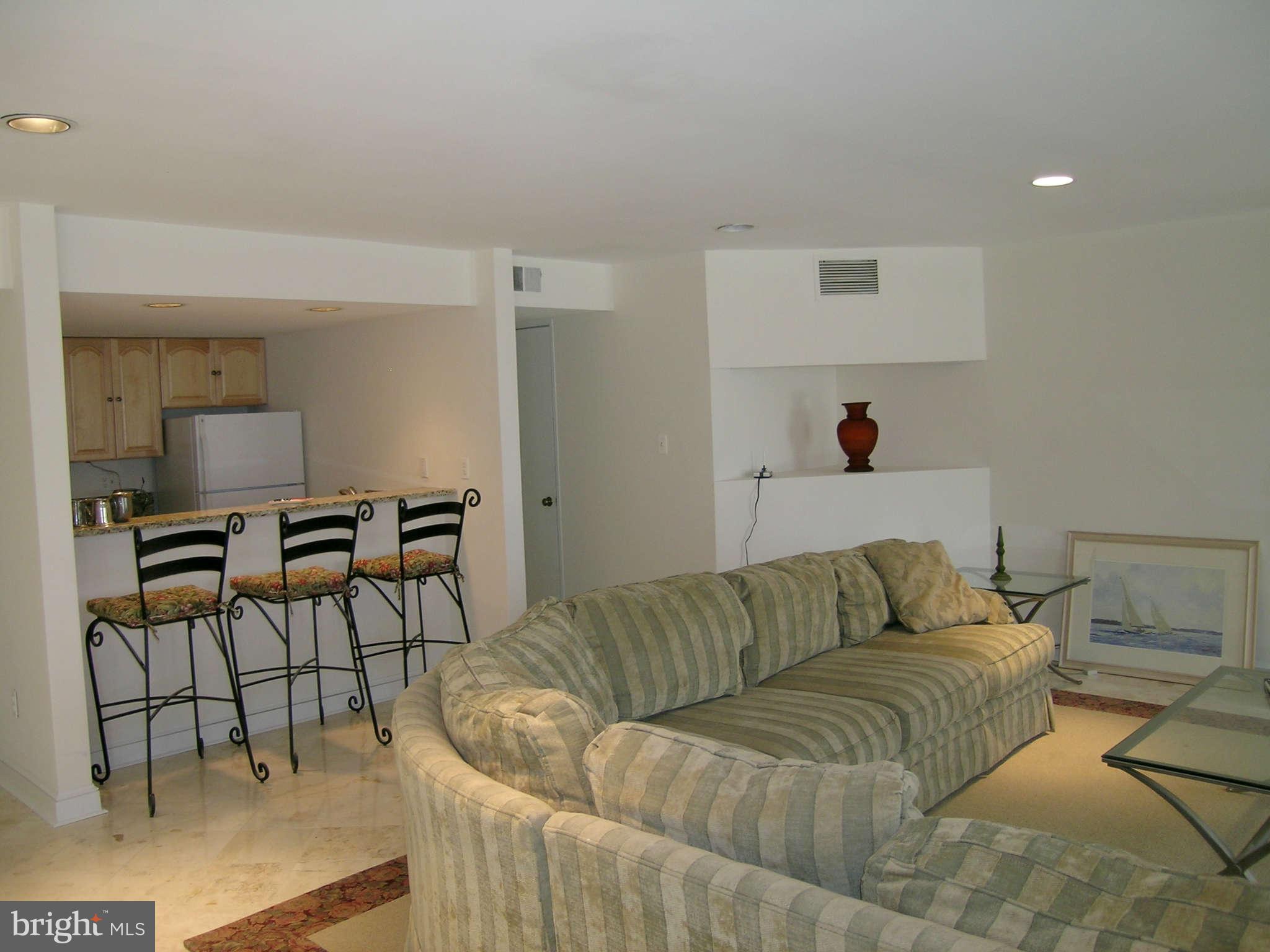 7570 Potomac Fall Road McLean, VA 22102 - Photo 17 of 20 a living room with furniture and a couch